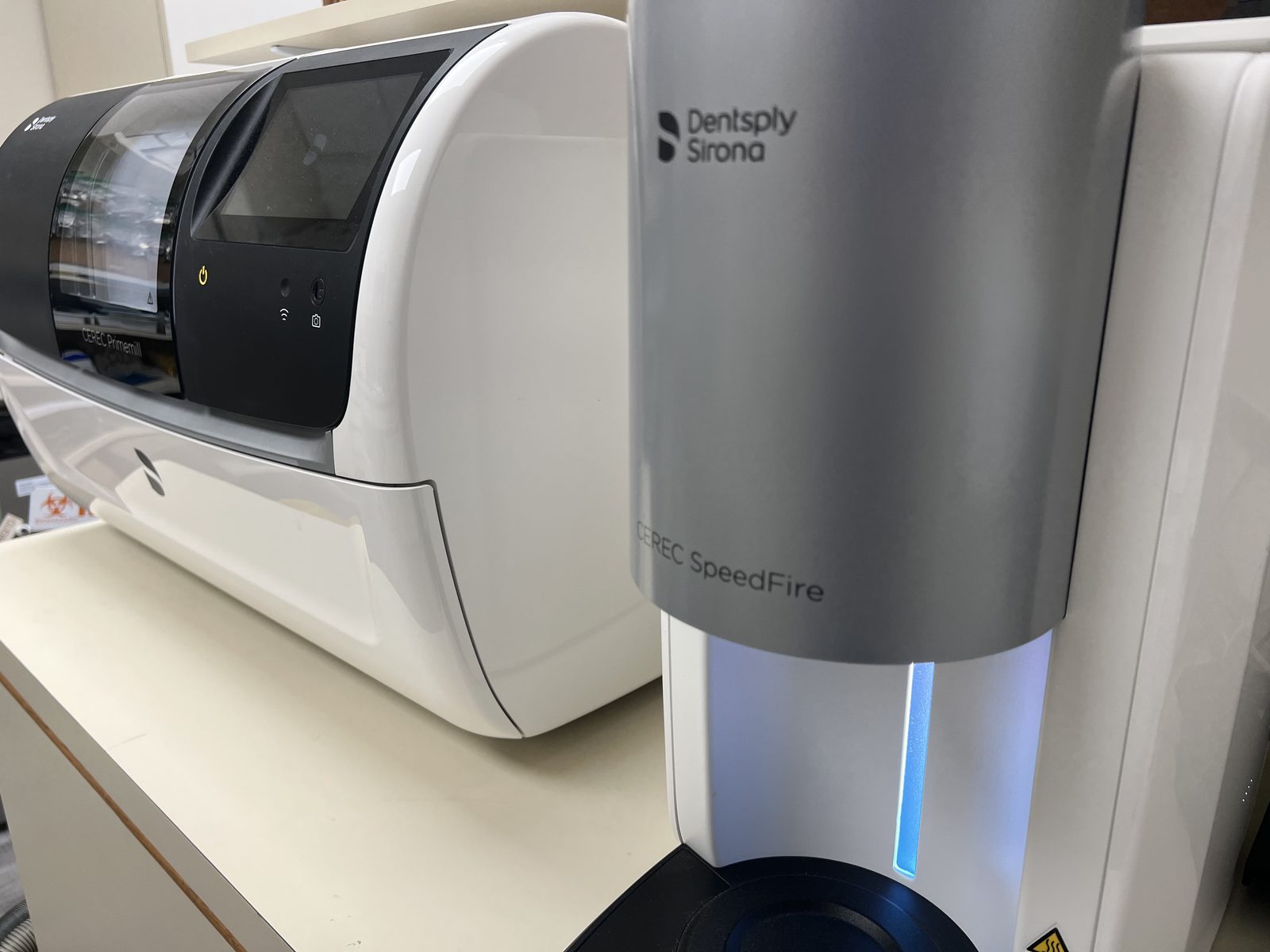 Dentsply Sirona CEREC Primemill and CEREC SpeedFire machines used to craft same-day crowns inside the AAA Court Family Dental office